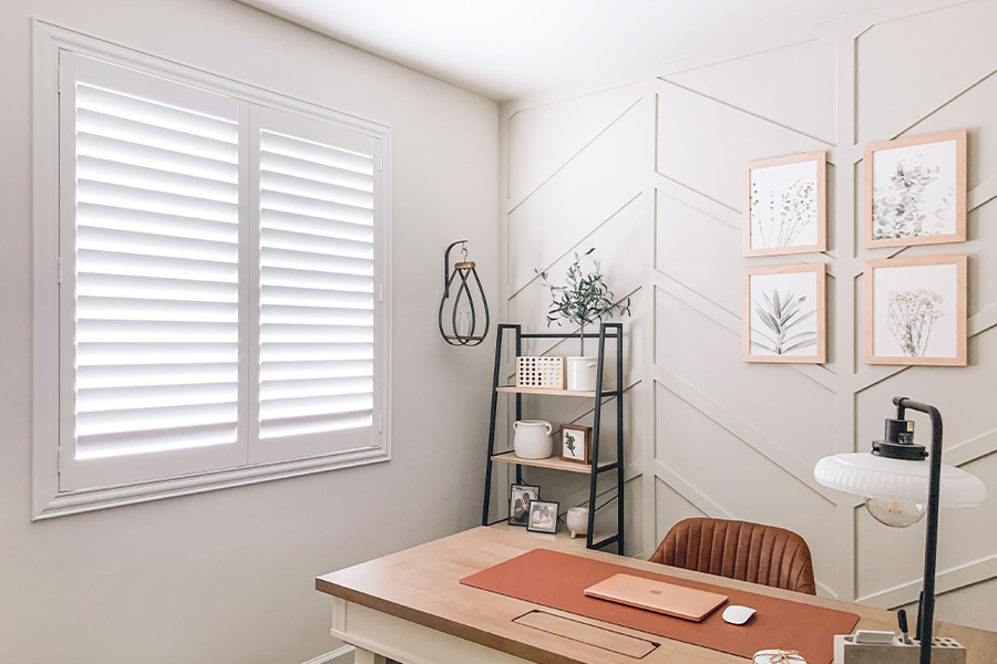 Polywood shutters give you maximum control over natural light in your Chicago home. Photo Credit: @OurLakepoint Farmhouse White and off-white farmhouse style office with natural light from polywood shutters.